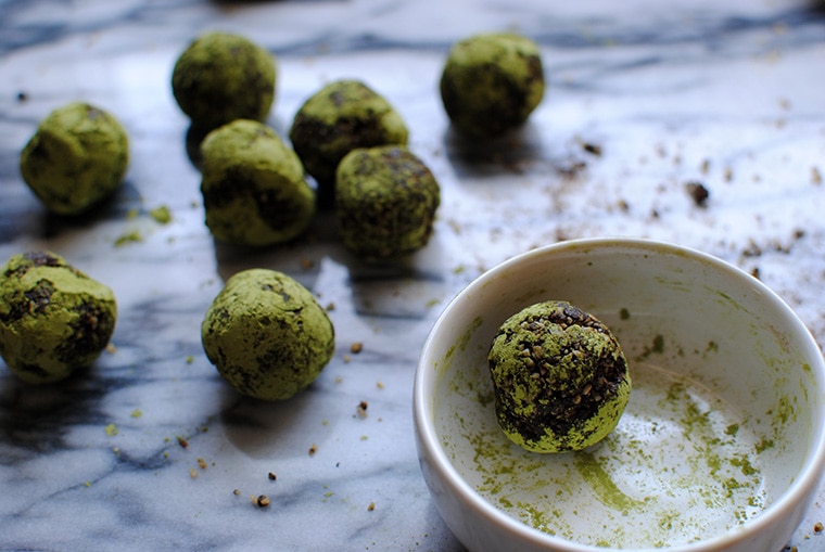 Chocolate Matcha Balls on a Marble Cutting Board