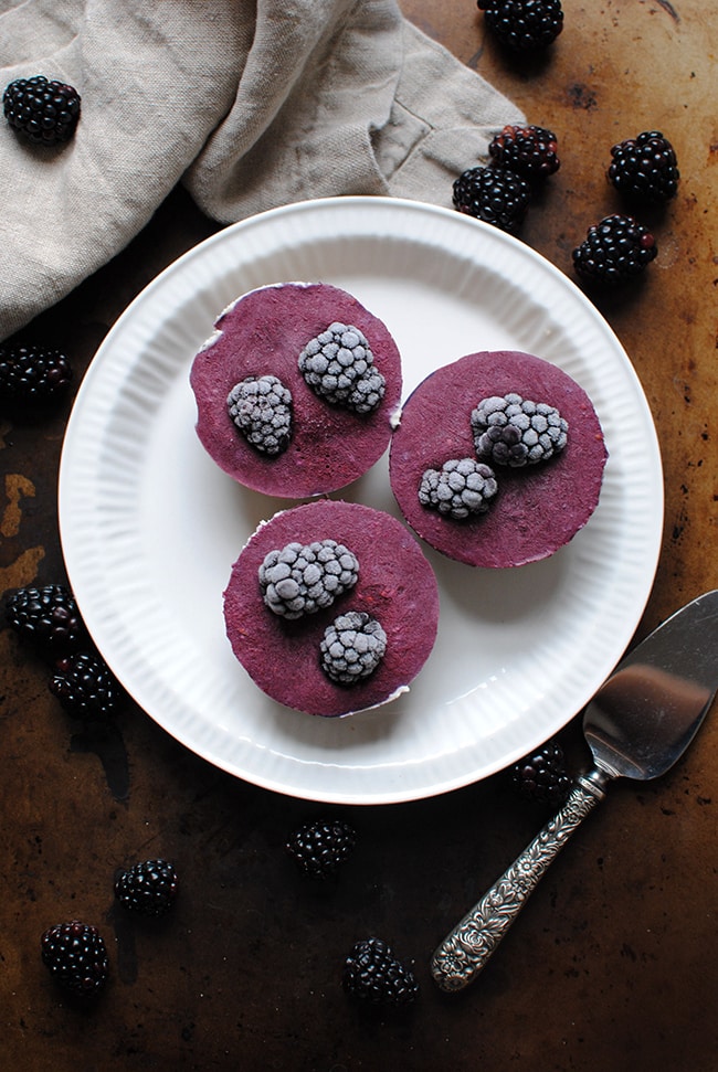 Raw Cheeescakes Made with Blackberries on a plate