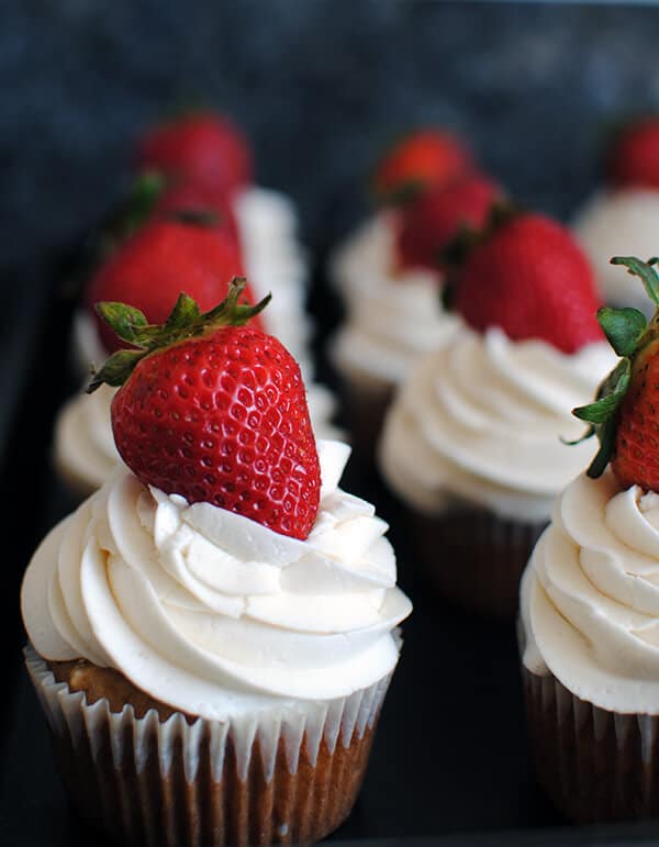 Strawberry Cupcakes: This homemade strawberry cupcake recipe is made from scratch with fresh strawberries and topped with vanilla buttercream!