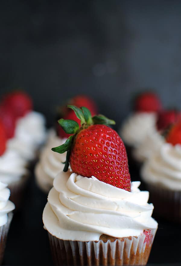 Strawberry Cupcakes: This homemade strawberry cupcake recipe is made from scratch with fresh strawberries and topped with vanilla buttercream!