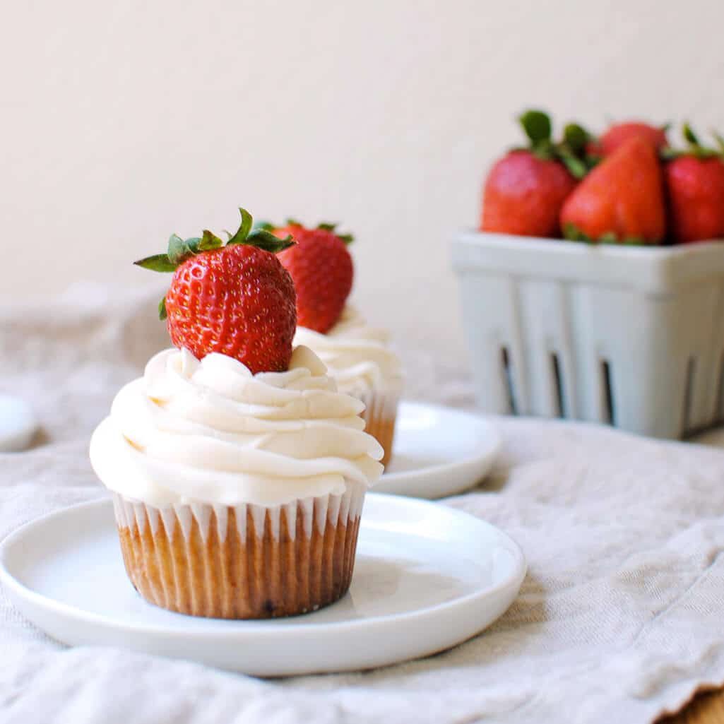 Strawberry Cupcakes: This homemade strawberry cupcake recipe is made from scratch with fresh strawberries and topped with vanilla buttercream!