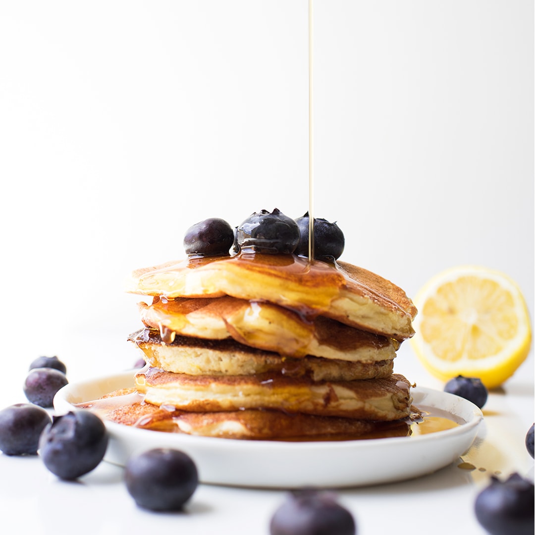 Easy Healthy Protein Pancakes on a white plate with syrup