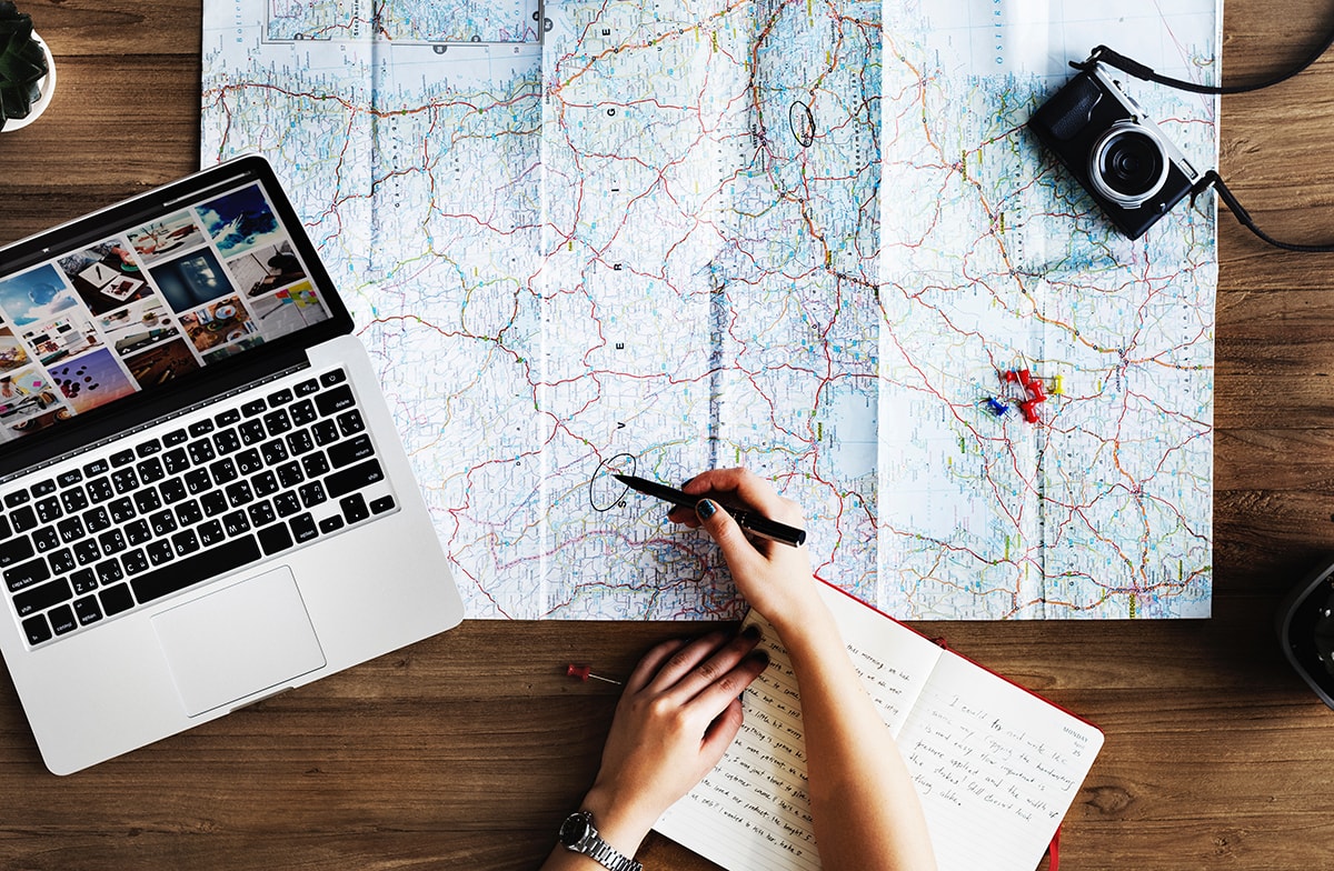 Solo Trip Tips - woman planning trip