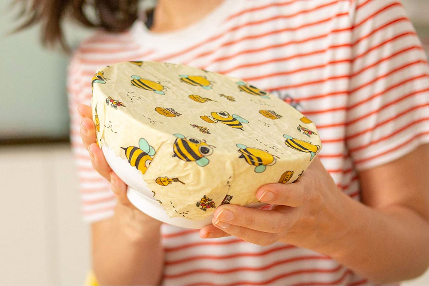 Beeswax Wrap - woman holding a bowl wrapped