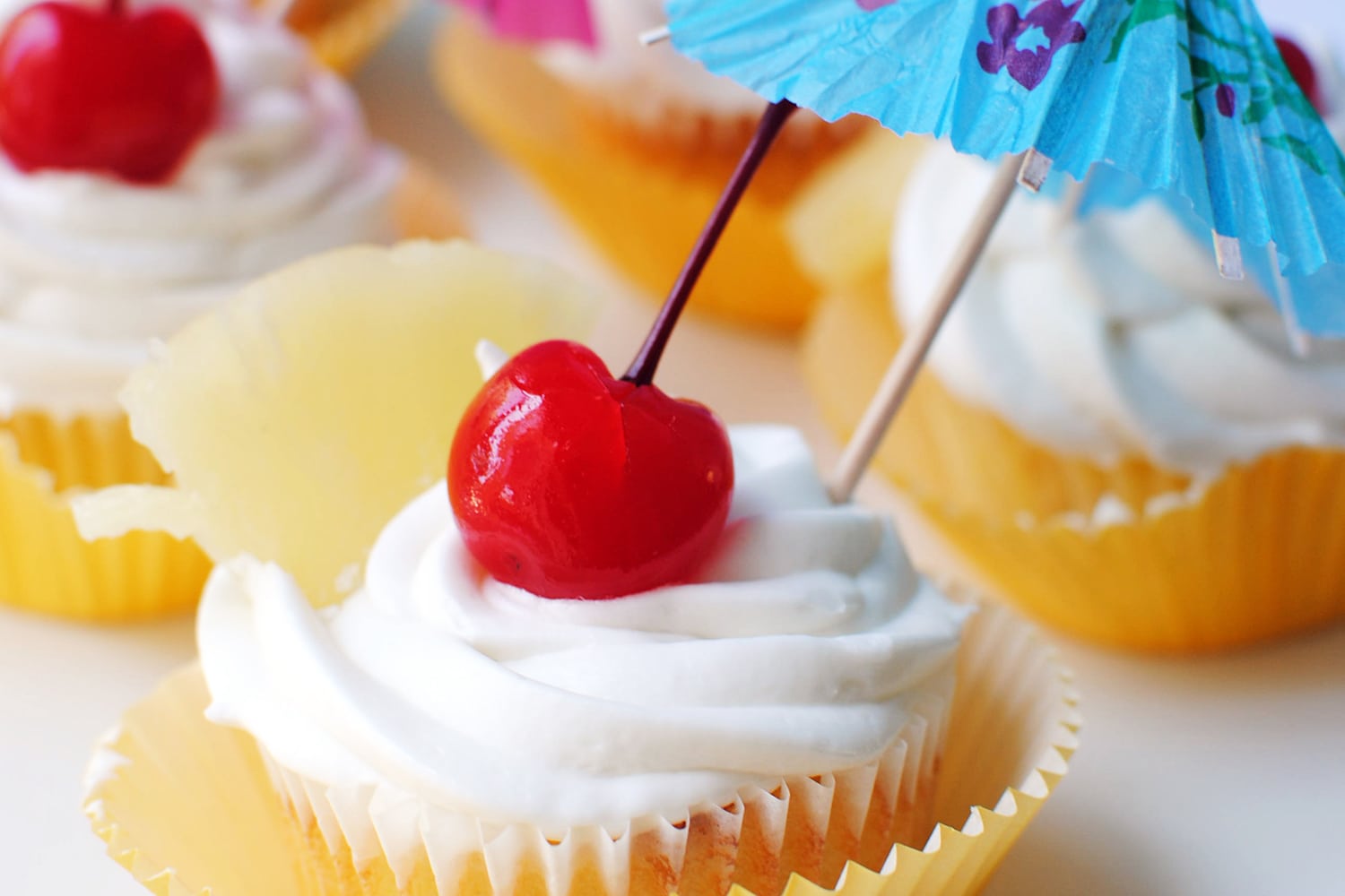 Pina Colada Cupcakes with Coconut Frosting - Let&amp;#39;s Eat Cake