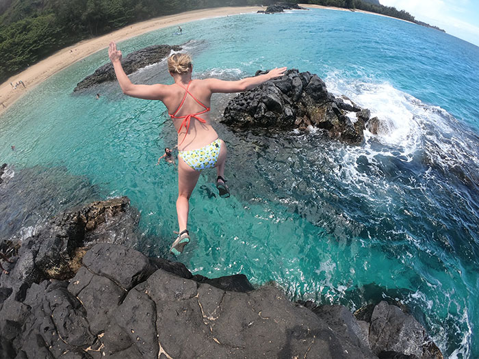 Is Travel Insurance Worth It - woman cliff jumping