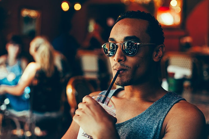 Millennial Slang and Gen Z Phrases - guy drinking coffee