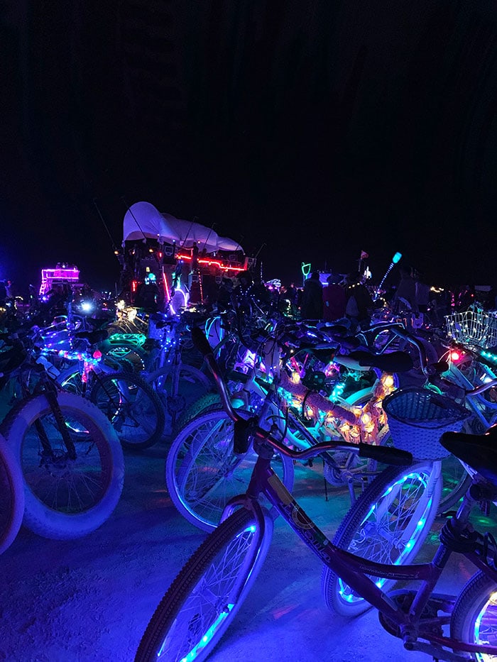 10 Principles of Burning Man - neon bikes at night on the playa