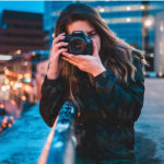 Best Camera for Blogging - woman holding canon