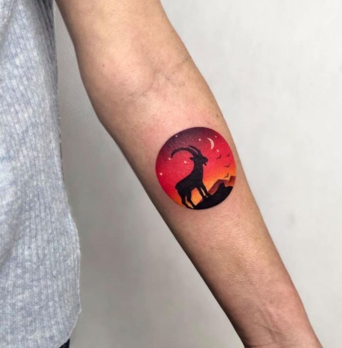 Capricorn tattoos - Black goat silhouette over sunset
