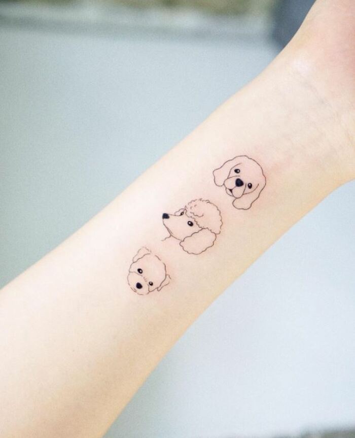 Minimalist Tattoos - Dog faces outline