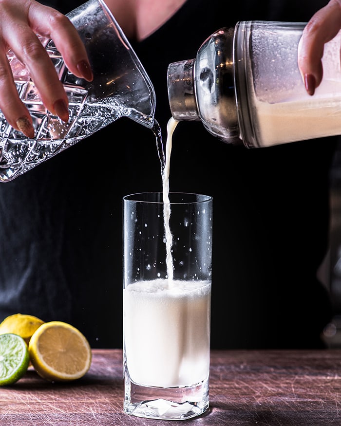 Ramos Gin Fizz - pouring from cocktail shaker