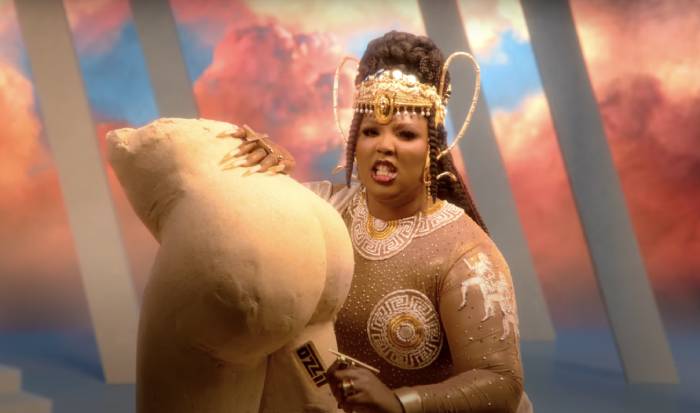 Lizzo Rumors Music Video - credit card swipe