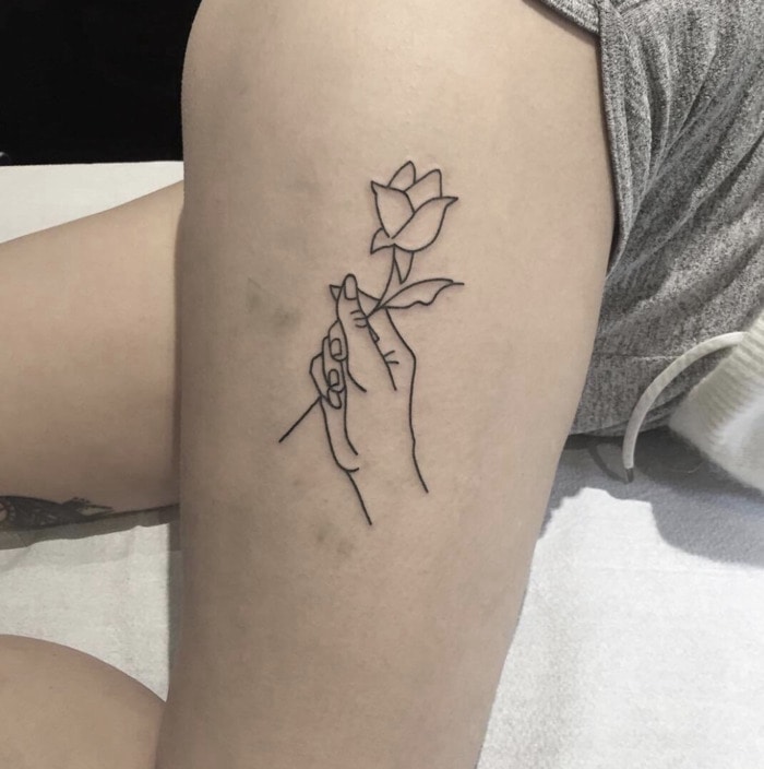 Small Tattoos - hand holding a rose