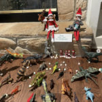 Naughty Elf on the Shelf - dinosaur feeding