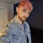 Nose Piercing Men - pink haired man with double nose ring