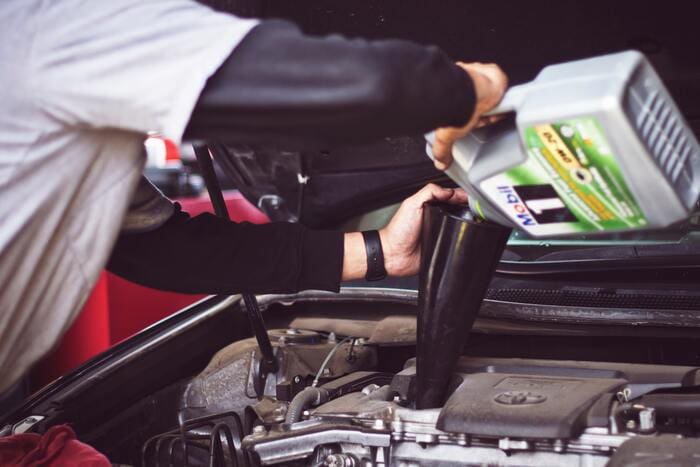 How to Change Your Oil - pouring oil