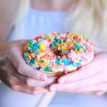 Doughnut or Donut - woman holding donut