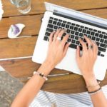 Email sign-offs - woman typing