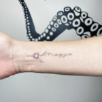 Small Wrist Tattoos - sun and mountain