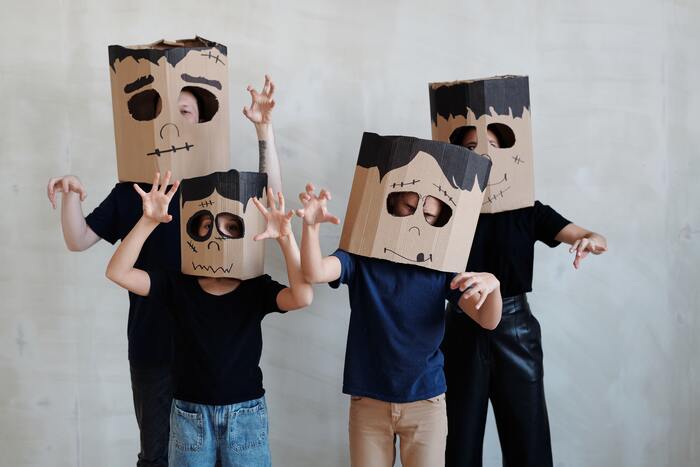 Halloween Puns -four people with ghost headpiece