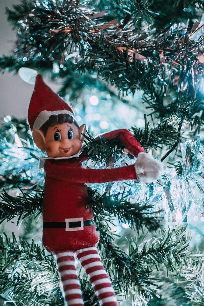 Christmas Puns Jokes - Elf Hanging on a Christmas Tree