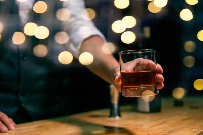 Best Cognac Brands - Woman holding glass