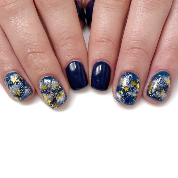 Hanukkah Nail Designs - Blue and White Marble Nails With Gold Stars