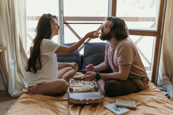 Cheap Valentines Day Ideas - couple eating in bed