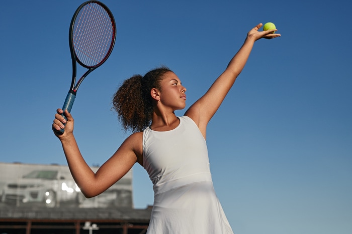 Physically Active Self Care Ideas - woman playing tennis