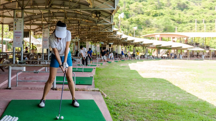 Physically Active Self Care Ideas - woman at driving range