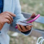 How to Stop Spending Money - purchasing on phone