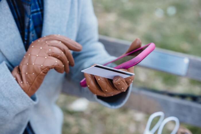 How to Stop Spending Money - purchasing on phone