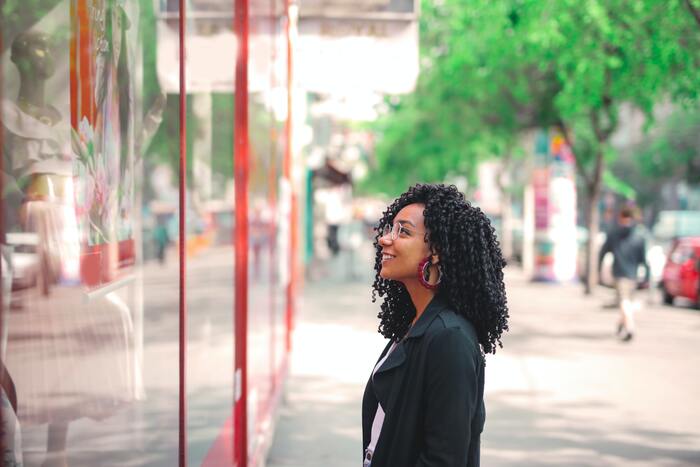 How to Stop Spending Money - woman window shopping