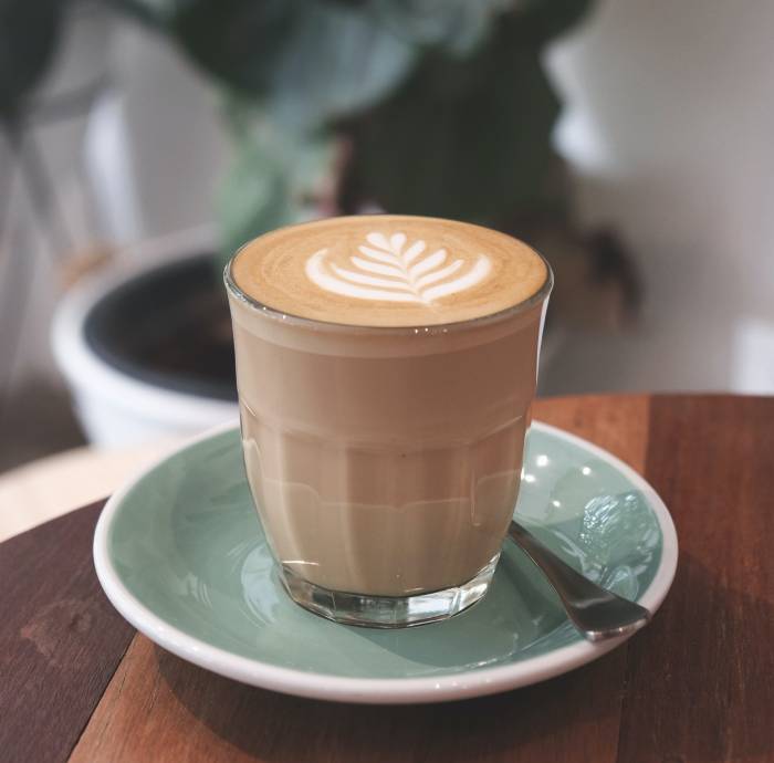 what is a cortado - glass on plate