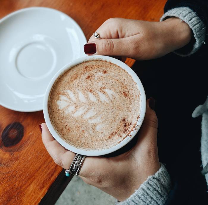 what is a cortado - holding a latte