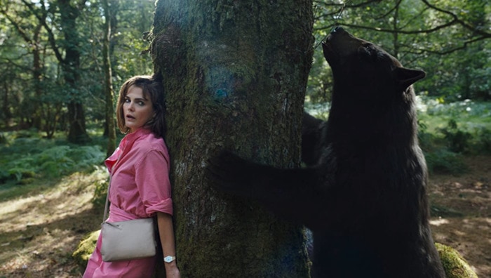 Cocaine Bear Facts - movie still of bear and actress