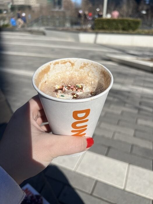 Dunkin Brownie Batter Signature Latte Review - hand holding with view of drink