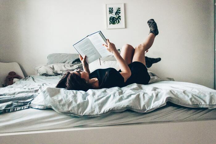 Literotica - woman reading in bed