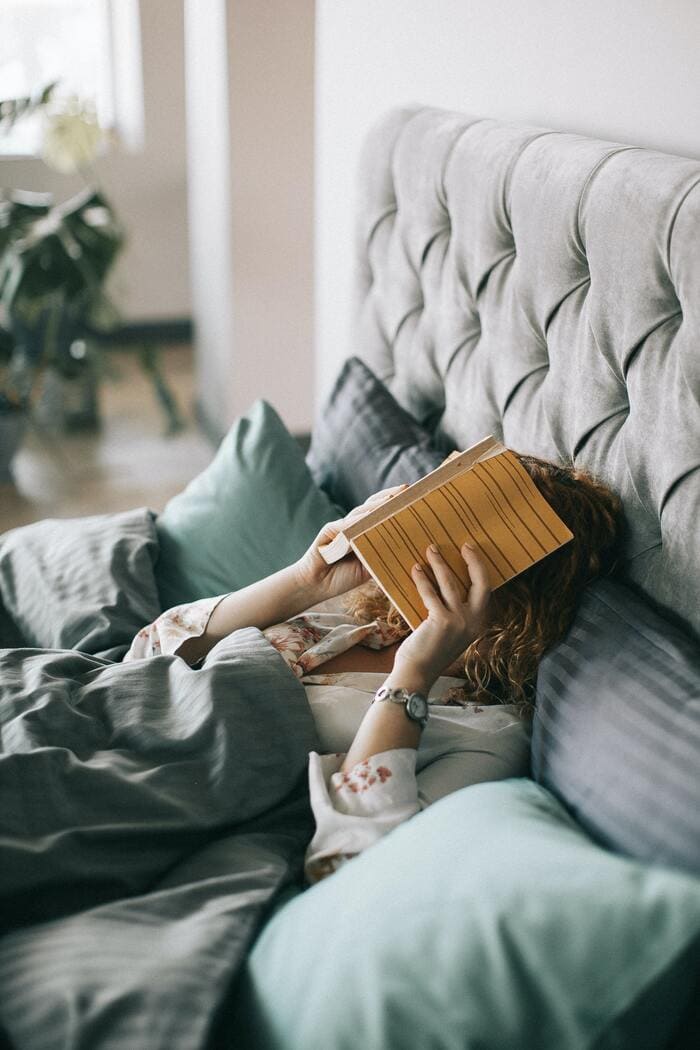 Literotica - woman reading in bed
