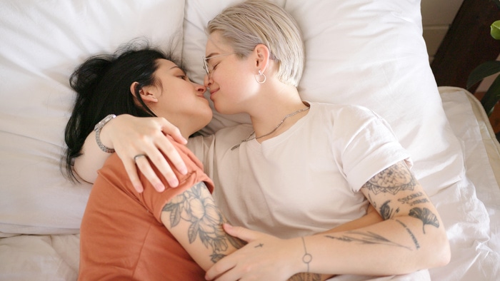 Pillow princess - lesbian couple in bed