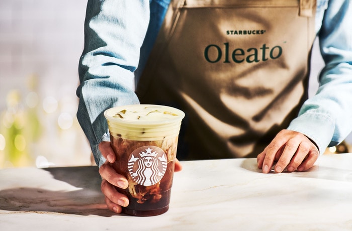 Starbucks Oleato Drinks - Barista Holding Beverage