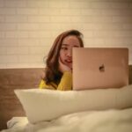 Best literotica- woman on computer in bed