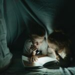 Fun winter activities- kids reading in blanket fort