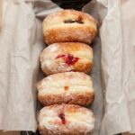 Paczki - paczkis in a baking tin