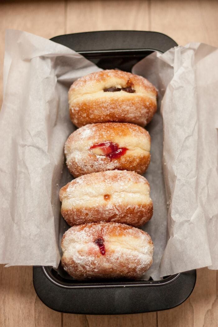 Paczki- paczkis in a baking tin