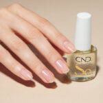 CND Cuticle Oil with manicured hand