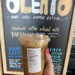 Starbucks Secret Menu Oleato Drinks - holding shaken oleato espresso with oleato sign