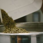 how is decaf coffee made - green beans poured into a vat