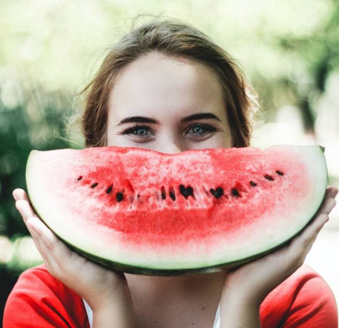 watermelon jokes - smiling with a watermelon slice